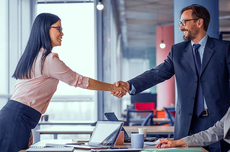 services - man and woman shaking hands