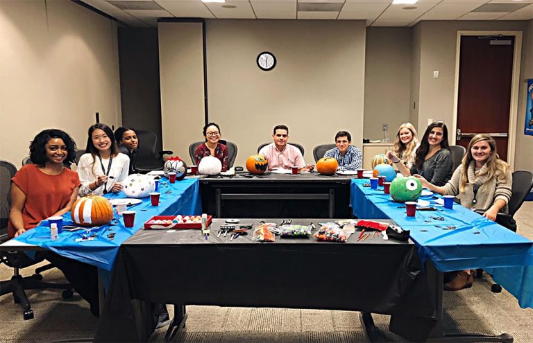 Printpack interns sitting at a conference table.